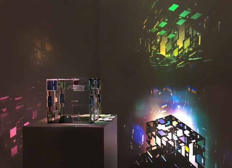 A glass cube and reflections of light passing through it