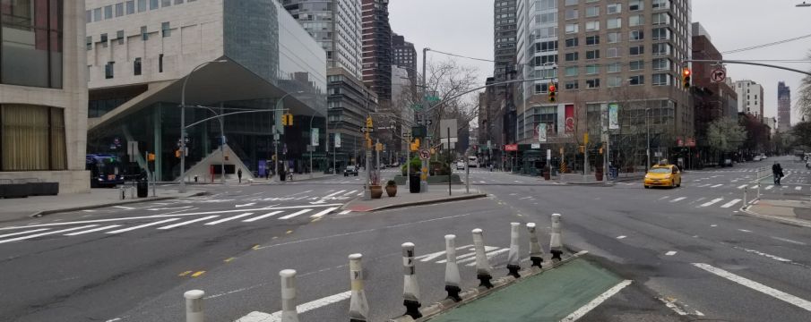 the nearly empty intersection of Broadway, Columbus Ave, and 65th Street in March 2020